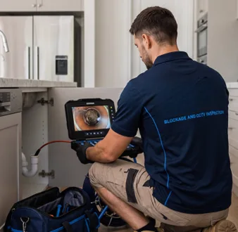Clearing a blocked sink at a Ambarvale property